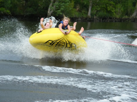 Catching air while tubing.  Who needs Disneyland when you can hve a ride like this!