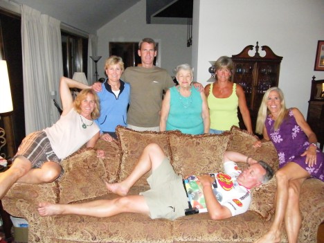Now a shot with our mother:  Left to right:  Cathy, Sharon, Tim, Mom, Pam, Me and Barry still power napping on the couch!