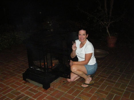 Mimi starting a fire in the fire pit so we could make some Somores!  Yummy