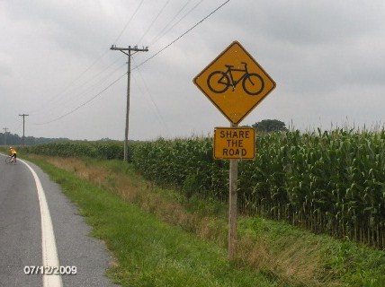 Notice the sign (Share the Road!)  If small farm towns can put up signs to share the road with cyclists, why can't Redlands?